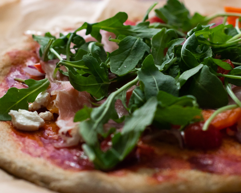 Gluten free proscuitto, arugula and cashew "ricotta" cheese pizza