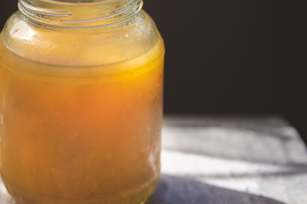 chicken bone broth in glass jar